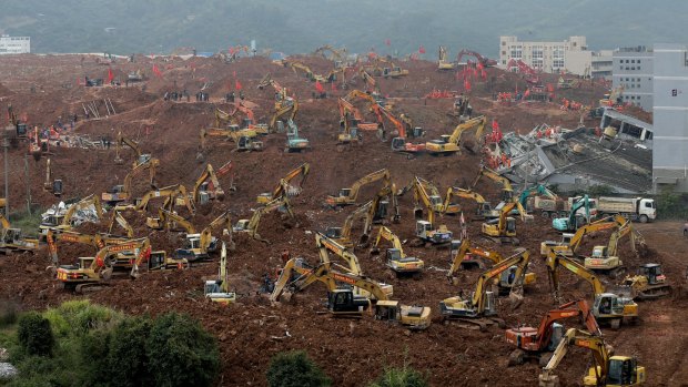 Rescuers search for survivors following a landslide in Shenzhen.