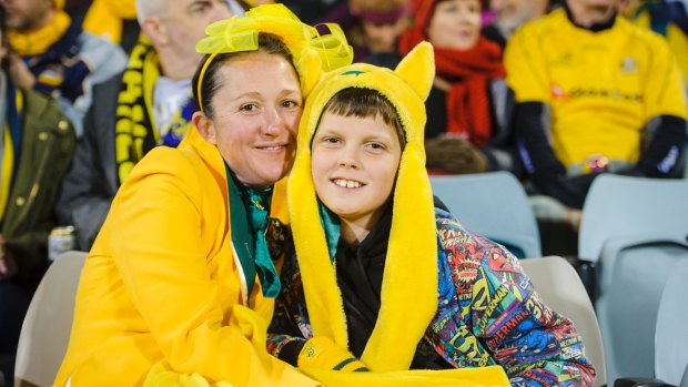 Zoe and nine-year-old Ben Hancock from Holder enjoy the Wallabies game at Canberra Stadium.