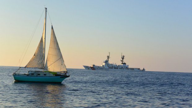 The sailing vessel is towed back to Hawaii after spending 12 days lost at sea. 