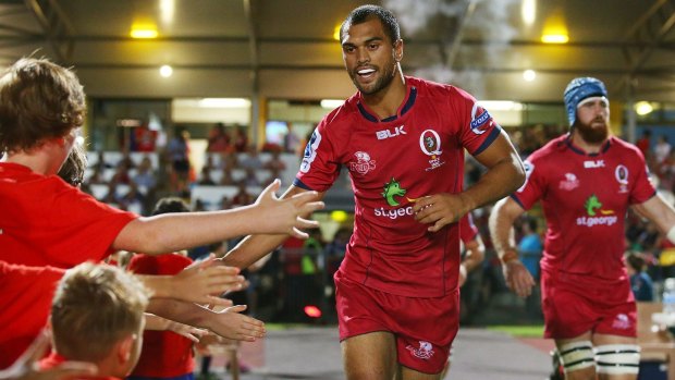 Karmichael Hunt of the Reds runs out in his return to rugby.