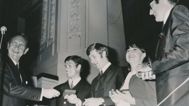 Prime Minister John Gorton presents the singing group The Seekers with plaques to commemorate their being named Australians of the Year in 1968.
