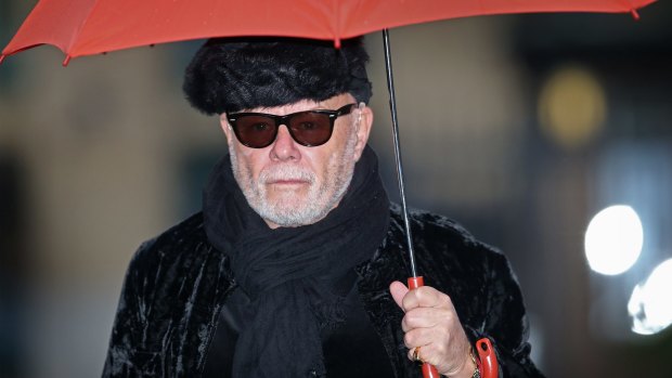 Gary Glitter arrives at the London court to hear his sentencing.