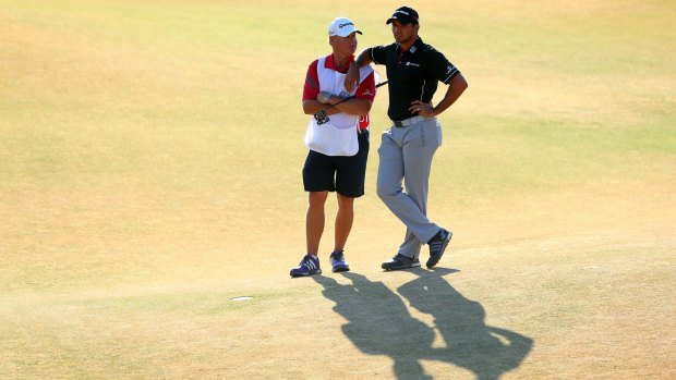 Jason Day with his caddie Colin Swatton in the 18th.