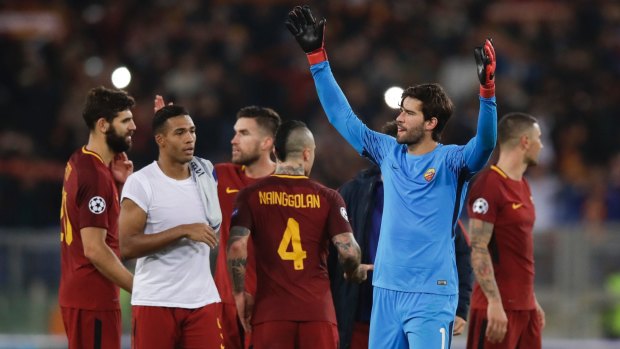 Roma goalkeeper Alisson celebrates his side's win over Chelsea.