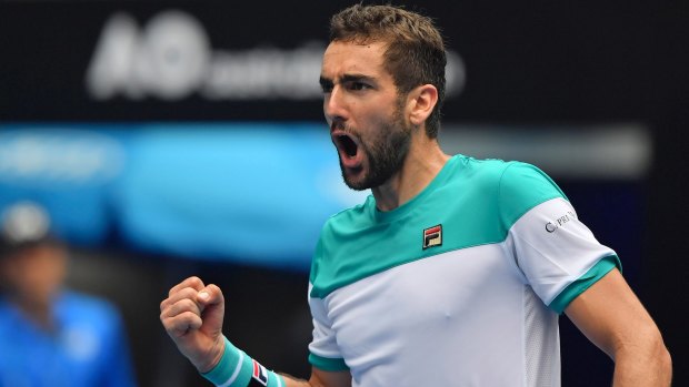 Croatia's Marin Cilic celebrates after defeating Spain's Pablo Carreno Busta in their fourth round match at the Australian Open.