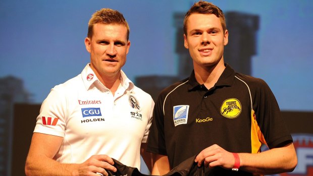 Collingwood coach Nathan Buckley with then new draftee Matthew Scharenberg in 2013.