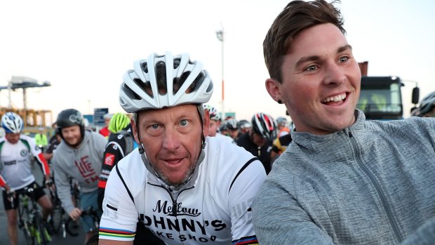 A local takes a selfie with Lance Armstrong.