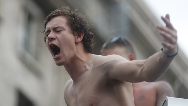 An England supporter shouts out in downtown Marseille, France, where supporters clashed with locals.