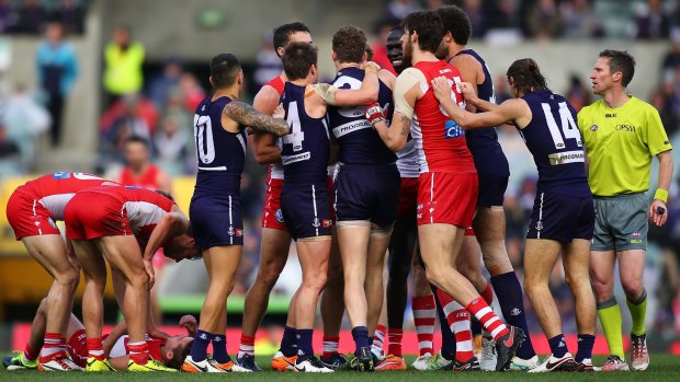 Swans and Dockers settle things after Dawson's hit on Lloyd.