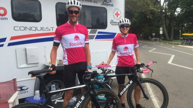 The couple in their sponsorship gear. Sponsor Foodora delivers their evening meal, and they plan to raise $100,000 for the Red Cross.