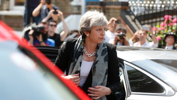 British Prime Minister Theresa May arrives near the scene where a van struck pedestrians.