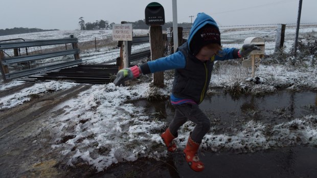 Leon Moir sees snow for the first time at Hampton in the NSW central west.