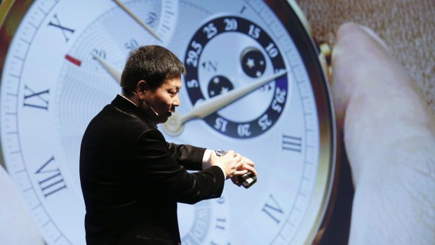 Huawei's Business Group CEO Richard Yu demonstrates Huawei's "luxury" smartwatch.
