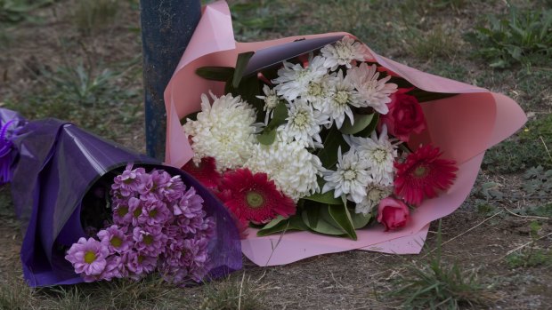 Flowers at the scene where a teenage girl was stabbed to death.