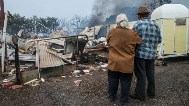 Property owners Jim and Lorraine inspect their destroyed house near the South Australian town of Roseworthy.