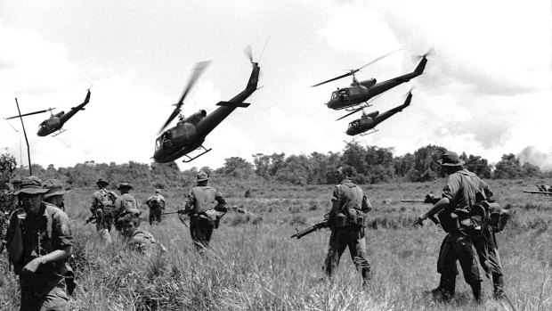 As the jungle war against the Vietcong intensifies in Vietnam, Australian soldiers of the 1st Battalion scatter for cover after landing from helicopters to start a search and destroy operation in War Zone "D" in early July, 1965. 