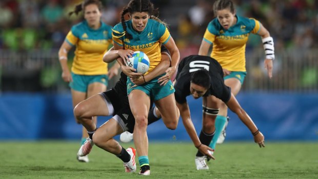 Charlotte Caslick of Australia runs during the Gold Medal Rugby Sevens match against New Zealand. 