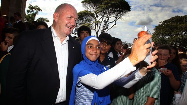 Sir Peter Cosgrove, Governor General of Australia, poses for a selfie with Danielle Rifahi from Parramatta West School on Australia Day.