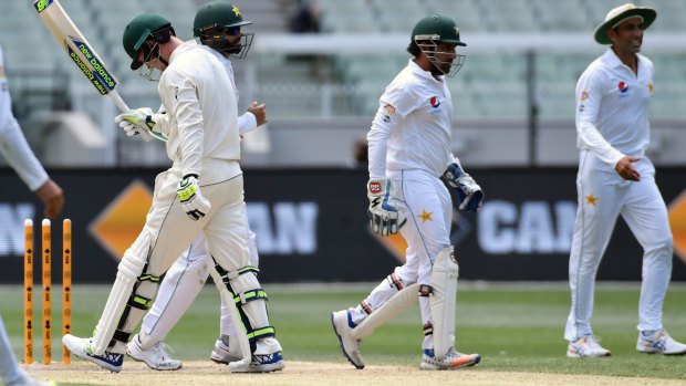 Nic Maddinson walks off after being bowled by Pakistan's Yasir Shah on day four of the MCG Test.