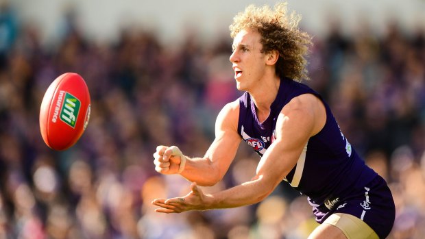 Chris Mayne is weighing up contract offers from up to four AFL clubs.