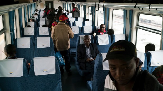 Passengers board the Nairobi-Mombasa train at the new Standard Gauge Railway terminal in Nairobi.