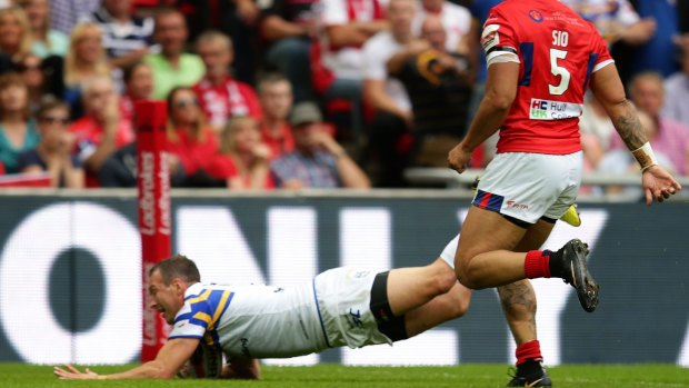 Mismatch: Danny McGuire of Leeds crosses during the 50-0 Challenge Cup annihilation of Hull KR at Wembley.