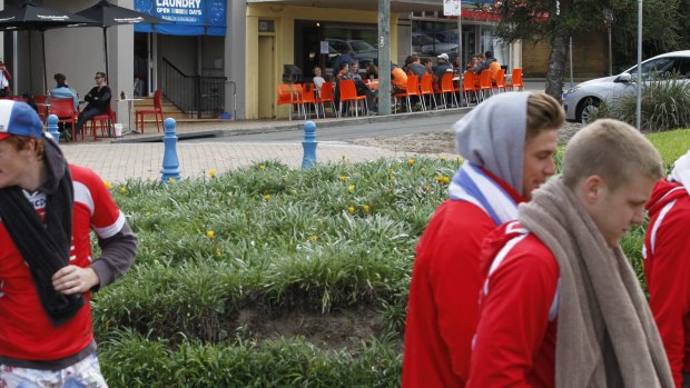 The morning after: Sydney Swans players and GWS players cross paths in Coogee.