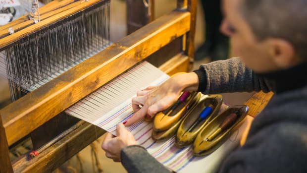 True artisans: Hand weaving in Italy's most celebrated handmade textile and weaving workshop.