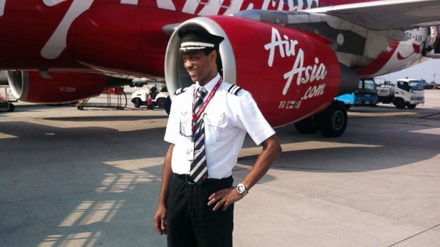 First officer: Co-pilot of the ill-fated AirAsia flight QZ8501 Remi Emmanuel Plesel, who is from the French island of Martinique, posing in front of an Air Asia aircraft.
