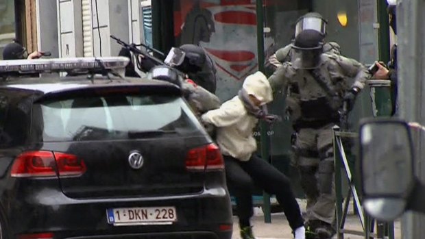 Salah Abdeslam is arrested by police during a raid in the Molenbeek neighbourhood of Brussels in March. 