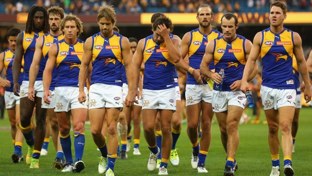 Winged:  A dejected West Coast leave the field after their 46-point loss to Hawthorn.