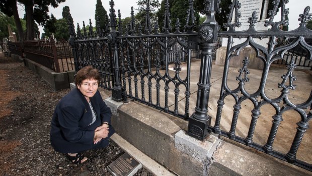Dr Celestina Sagazio at the Melbourne General Cemetery with the plaque in memory of Louisa Barrow.