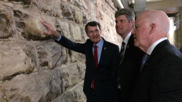 Lord Mayor Graham Quirk, Assistant Minister of State Stirling Hinchliffe and project leader Nigel Chamier with the newly uncovered 19th century wall holding up Ann Street.
