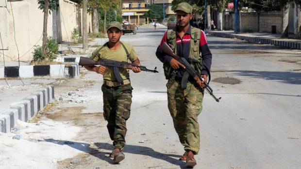 Free Syrian Army fighters patrol in Jarablus, Syria in August.