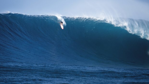Local legend and big-wave specialist Makua Rothman rides a Jaws monster estimated at 15-plus metres in 2012.