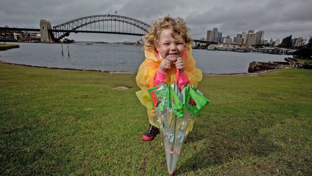 Cheer up: Holly Haugh, 4, enjoys a rainy day at McMahon's Point 