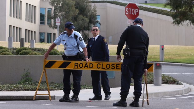 Australian Federal Police officers lockdown the ministerial entrance to Parliament House in Canberra after a security threat last September.