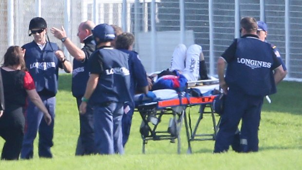 Horrifying: Kathy O'Hara is stretchered away after she came off Single Gaze during the Australian Oaks.