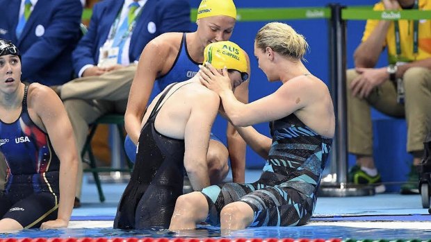 Superstar: Sarah Sjostrom (top) comforts Cate Campbell after her shock 100-metre freestyle final fourth place in Rio.