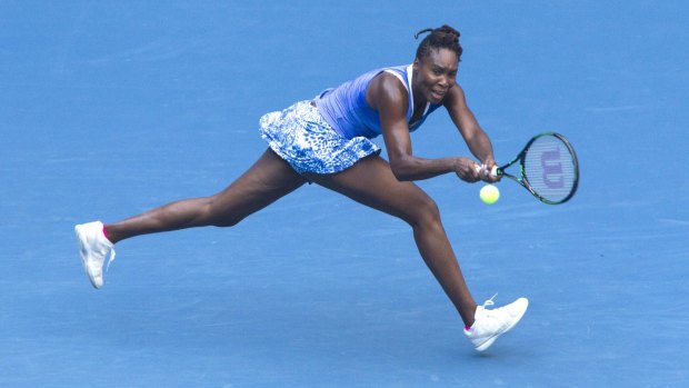 Venus Williams plays a  return during her semi-final against Roberta Vinci.