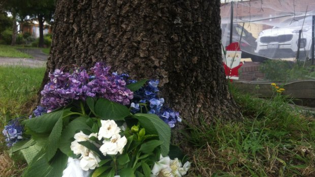 Flowers were laid outside the home on Sunday.