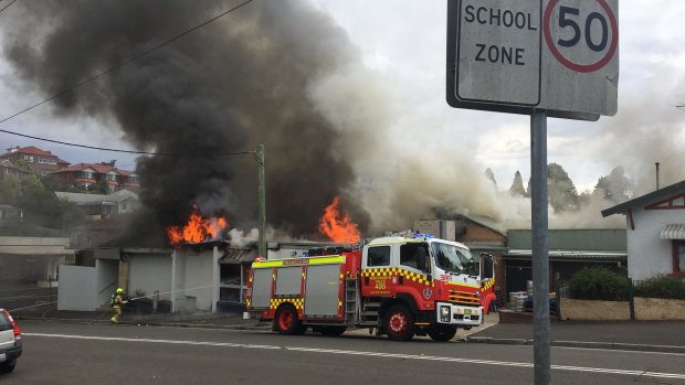 Smole and flames rise from the building, which was safely evacuated.