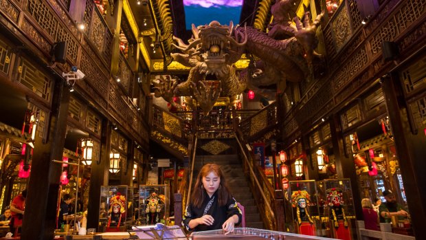 A glimpse of Panda Hot Pot's huge LED screen and dragon sculpture.