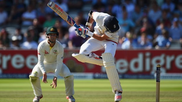 Stuart Broad takes evasive action to avoid an Australian bouncer at Lord's on Sunday.