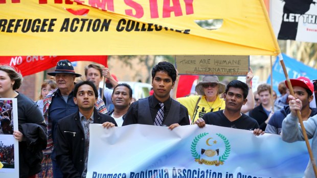 Saleem Mohammed is joined by other members of the Burmese Rohingya Association during a World Refugee Day rally at King George Square.