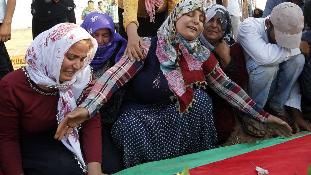 Relatives of a bomb victim mourn in Suruc.