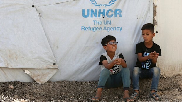 Iraqi internally displaced children play at a camp in Baghdad's western neighbourhood of Al Khadraa, Iraq.