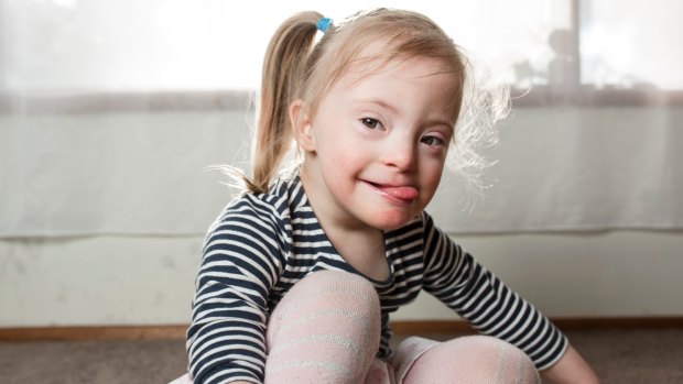 Three-year-old Olivia Ross has down syndrome as well as development issues such as difficulty swallowing after being born premature. She is about to miss out on early intervention therapies due to cuts to her NDIS support package. 