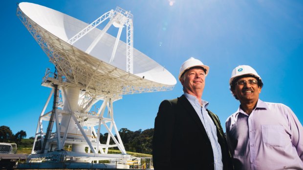 Canberra's deep-space communication station director Ed Kruzins (left) and NASA's network director Al Bhanji in front of the new antenna in Tidbinbilla.