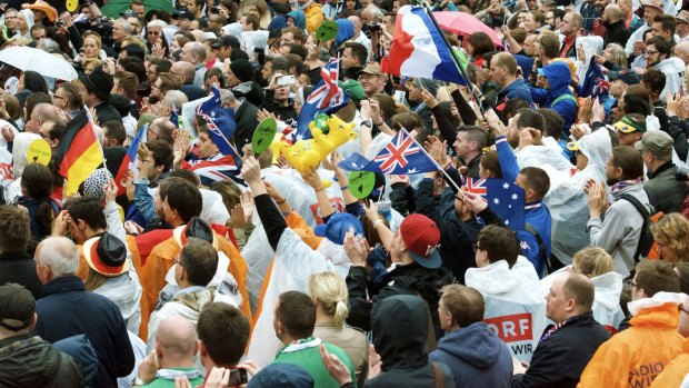 Australian fans show their support in the rain for Guy Sebastian at The Eurovision Village in 2015.